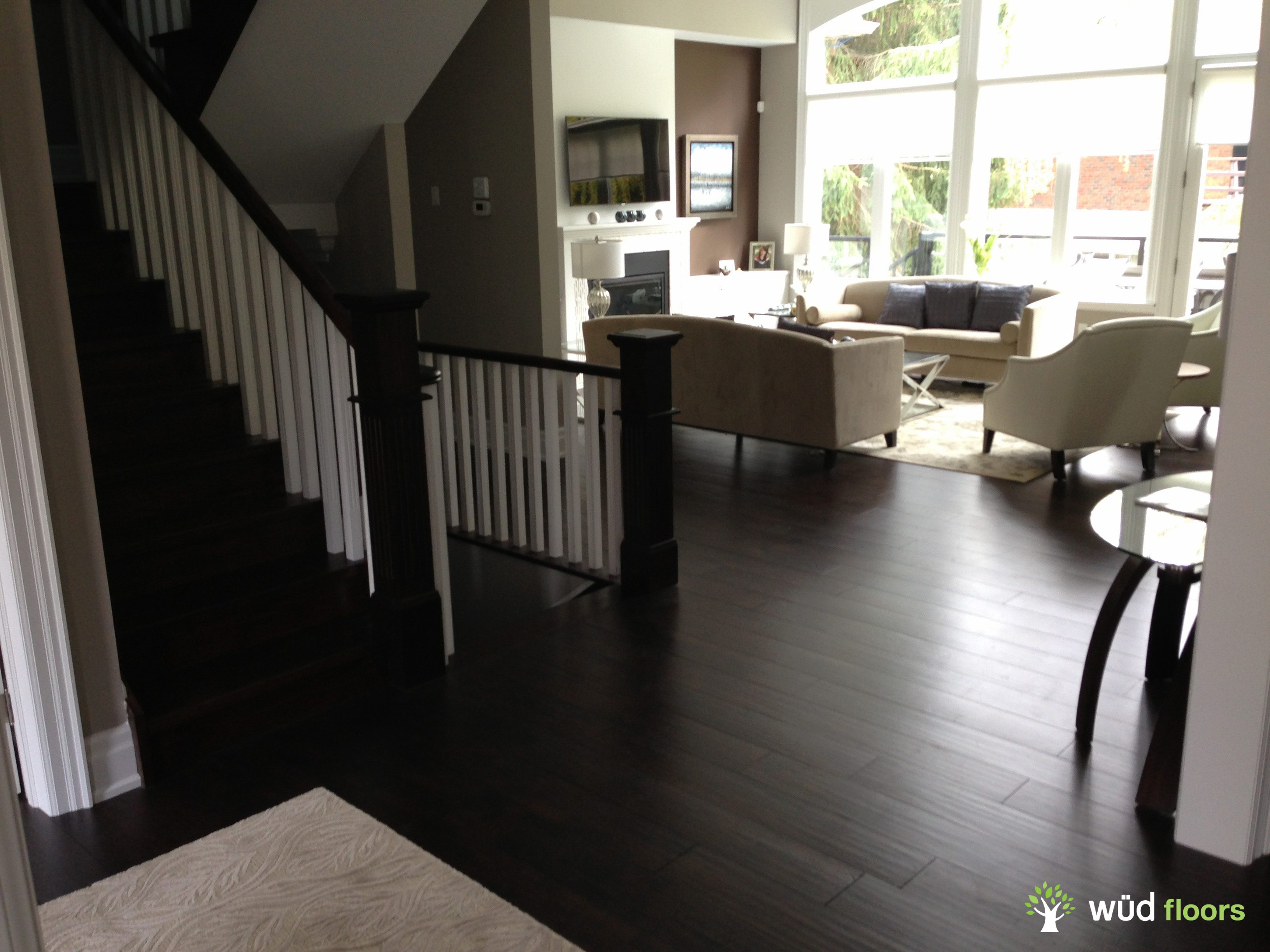 Beautiful living area and hallway with hardwood flooring